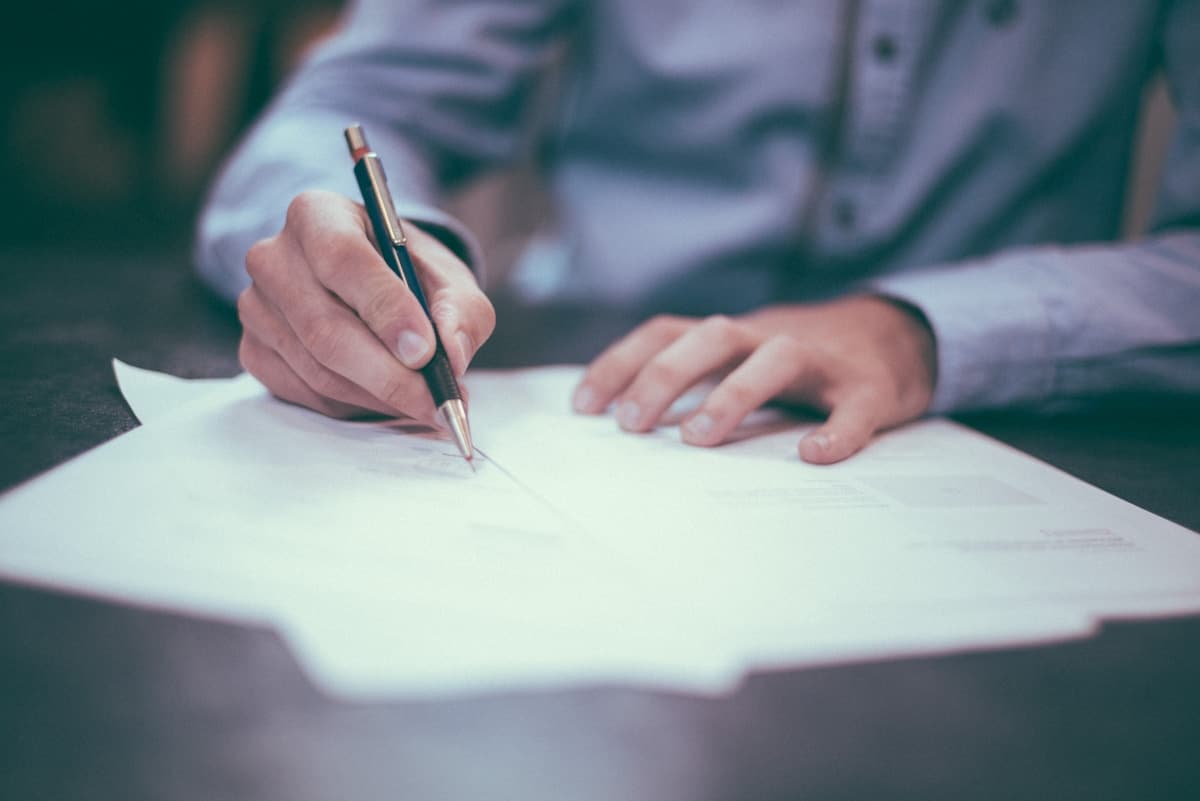 Used car buyer reviewing RideCheck inspection report during negotiation